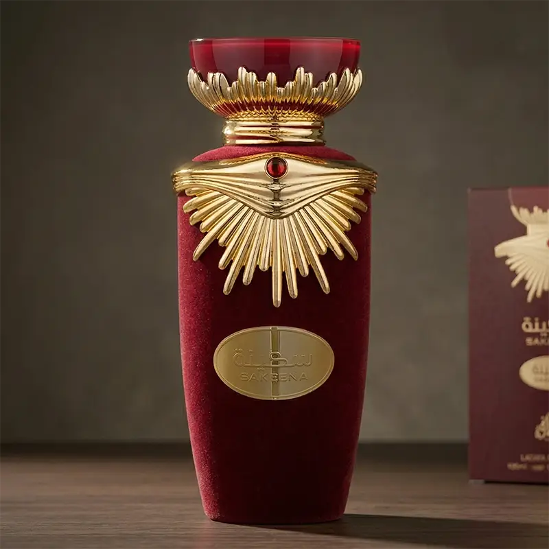 Luxury maroon velvet-textured bottle of Lattafa Sakeena perfume with a regally designed gold crown cap.